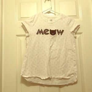 A cat shirt that says meow with cats all over it